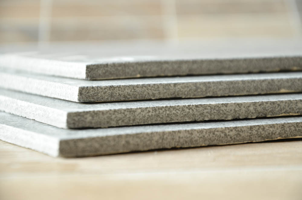 Stack of ceramic or stone tiles, grey and modern